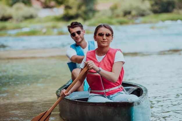 Man and woman kayaking on a river