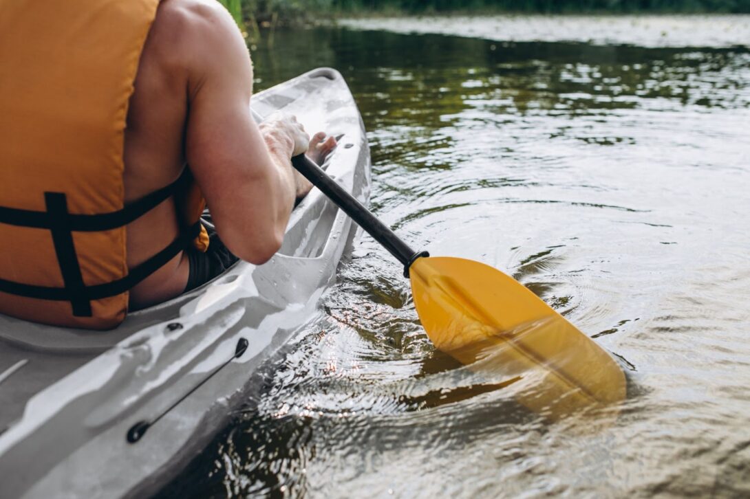 A man in a kayak paddling