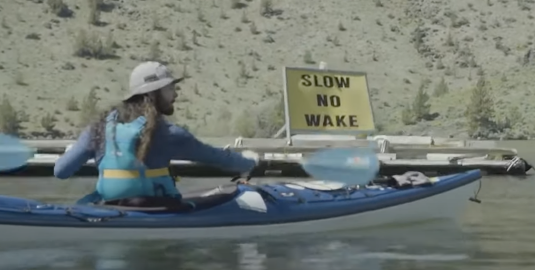 a man kayaking on the river