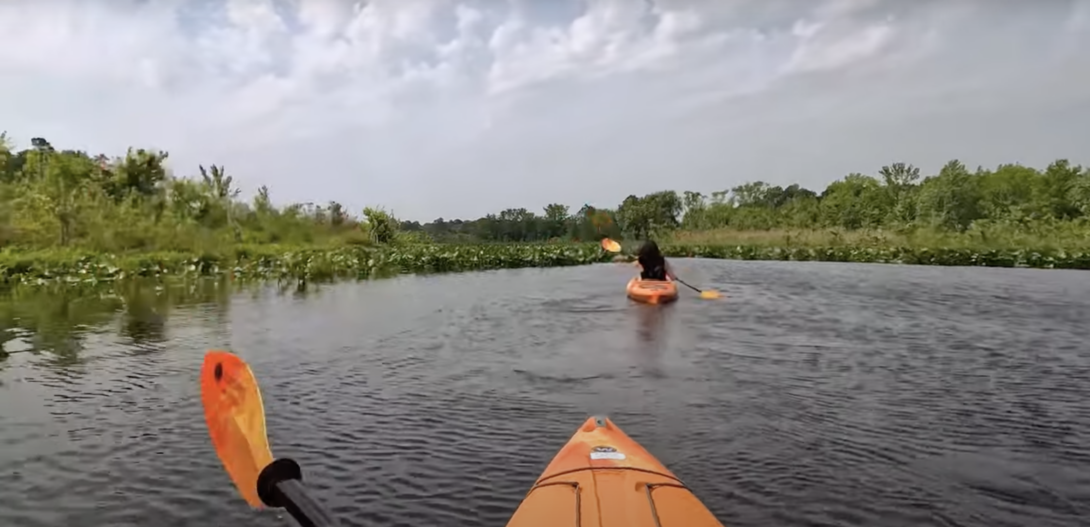 A man in a kayak paddling