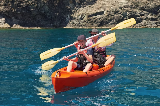 Man and child canoeing together